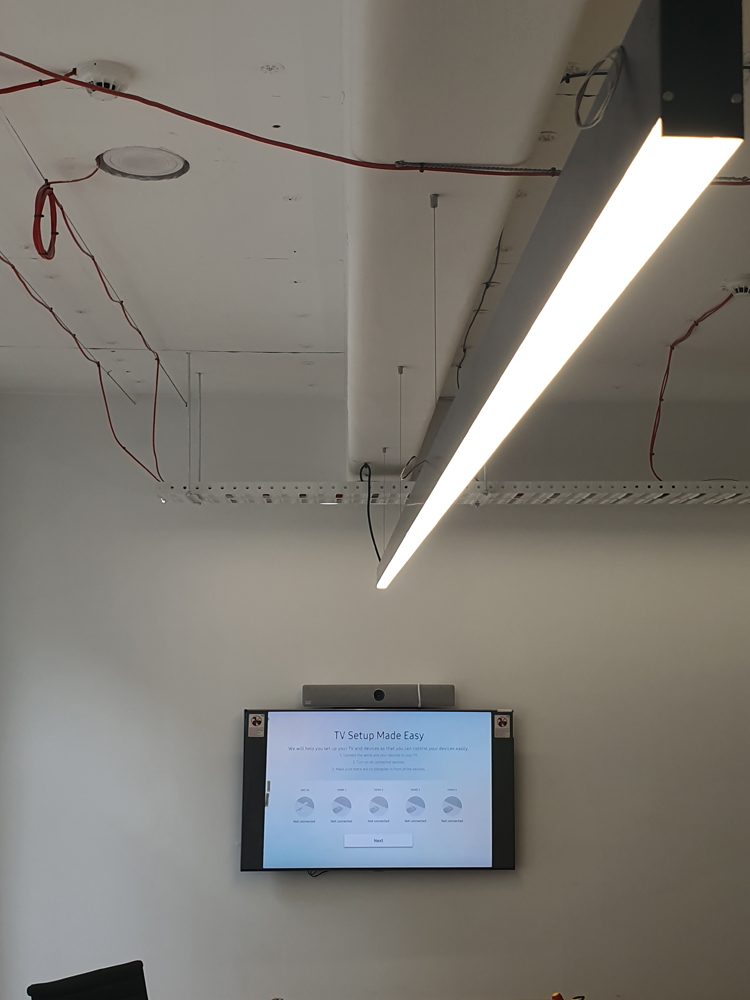 Linear light fitting set out before the ceiling is closed
