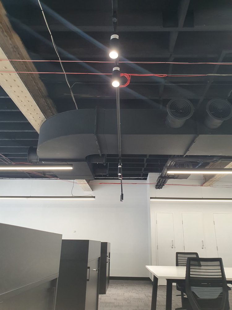 Workstations under track lighting
