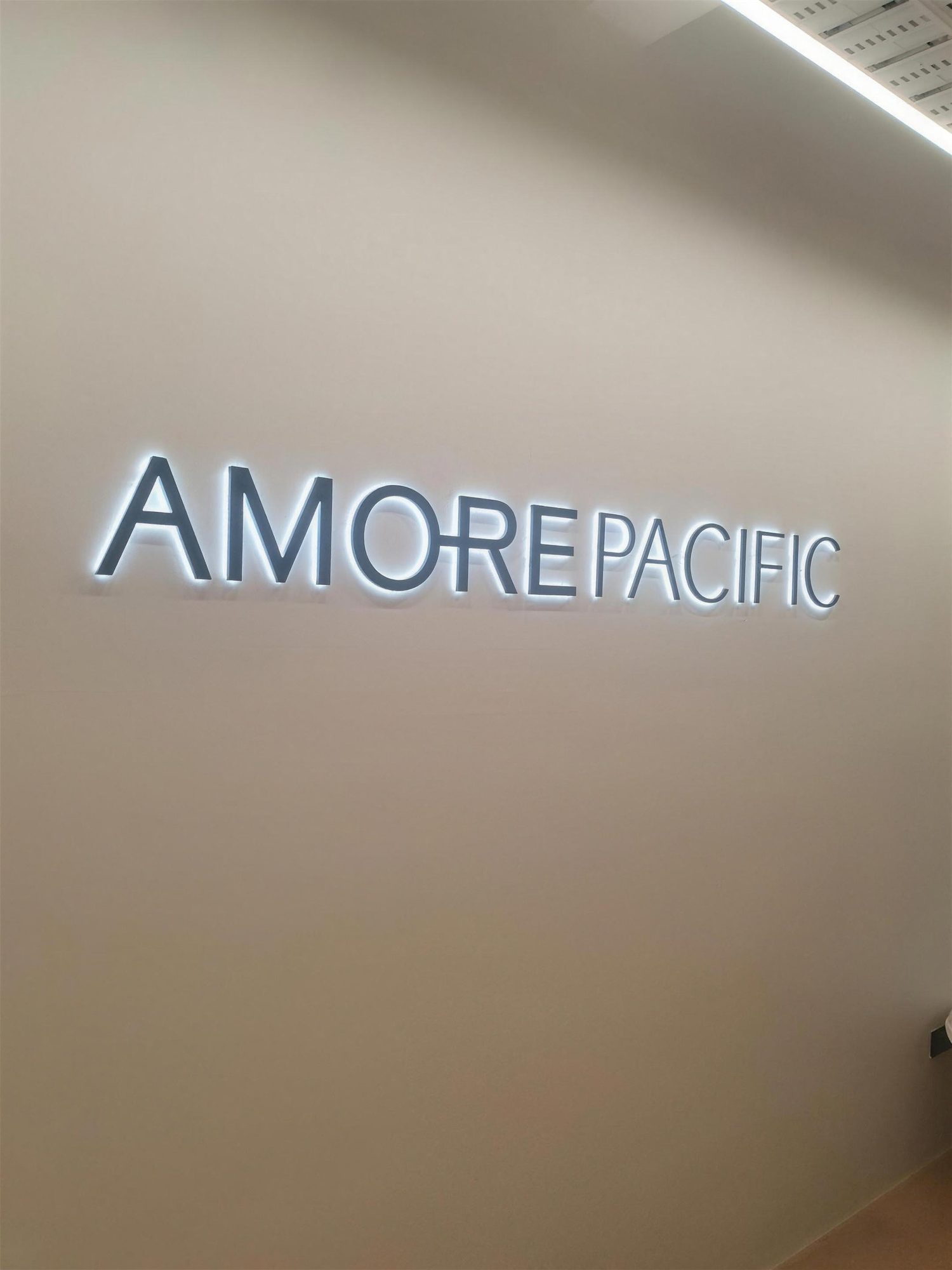 Amorepacific signage lit at reception